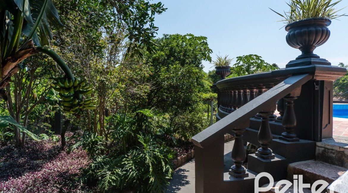 Casa em Condomínio à venda com 459m², 4 dormitórios, 4 suítes, 3 vagas, no bairro Cavalhada em PORTO ALEGRE