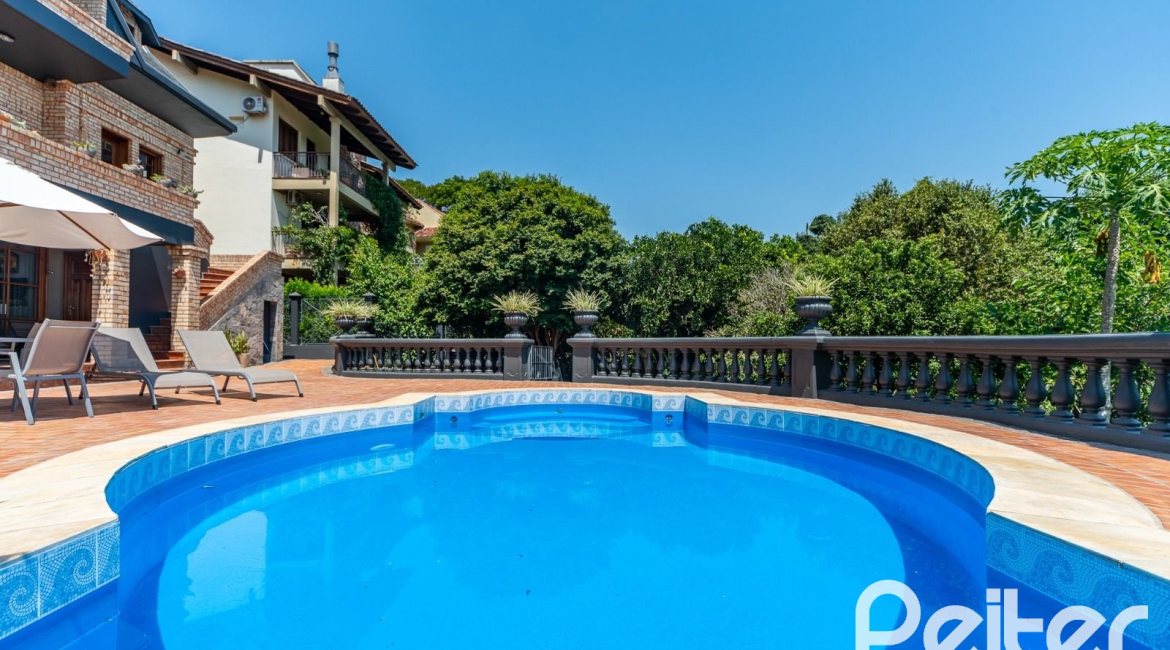 Casa em Condomínio à venda com 459m², 4 dormitórios, 4 suítes, 3 vagas, no bairro Cavalhada em PORTO ALEGRE