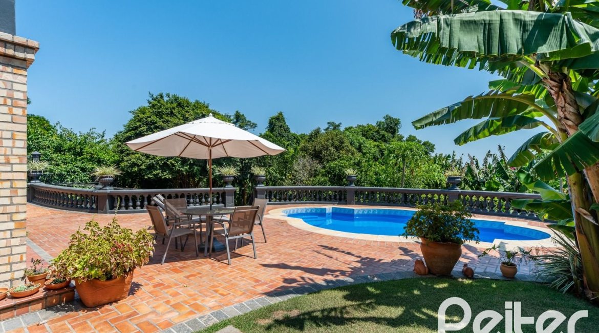 Casa em Condomínio à venda com 459m², 4 dormitórios, 4 suítes, 3 vagas, no bairro Cavalhada em PORTO ALEGRE