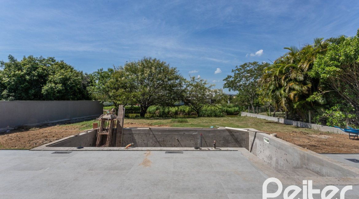 Casa em Condomínio à venda com 566m², 5 dormitórios, 5 suítes, 4 vagas, no bairro Terra Ville em PORTO ALEGRE