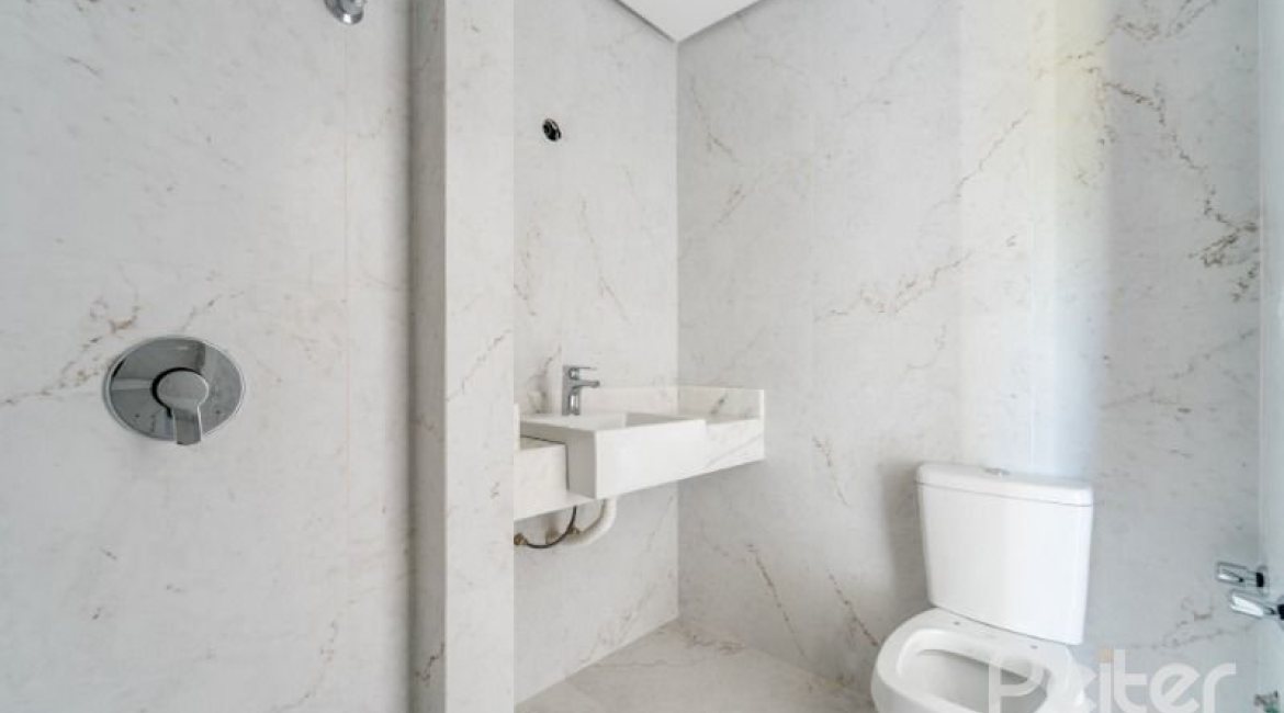 Casa em Condomínio à venda com 306m², 3 dormitórios, 3 suítes, 3 vagas, no bairro Vila Assunção em Porto Alegre