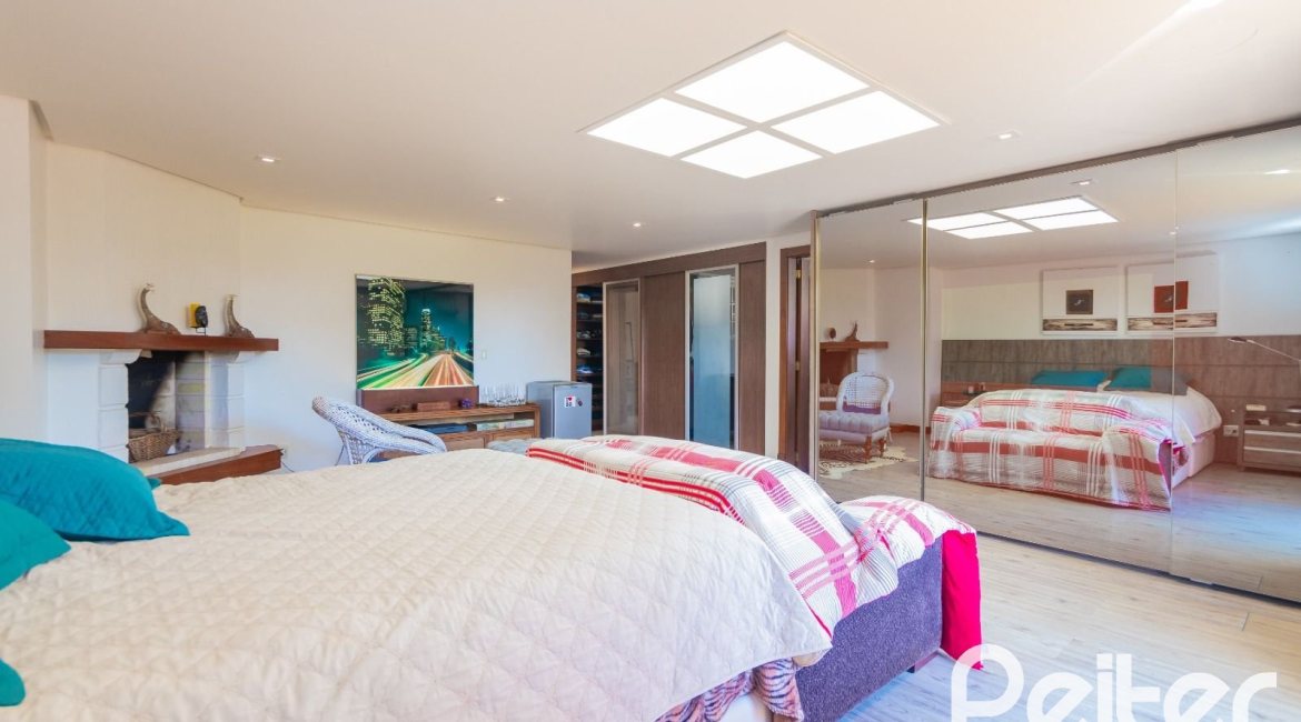 Casa em Condomínio à venda com 600m², 4 dormitórios, 4 suítes, 4 vagas, no bairro Terra Ville em PORTO ALEGRE