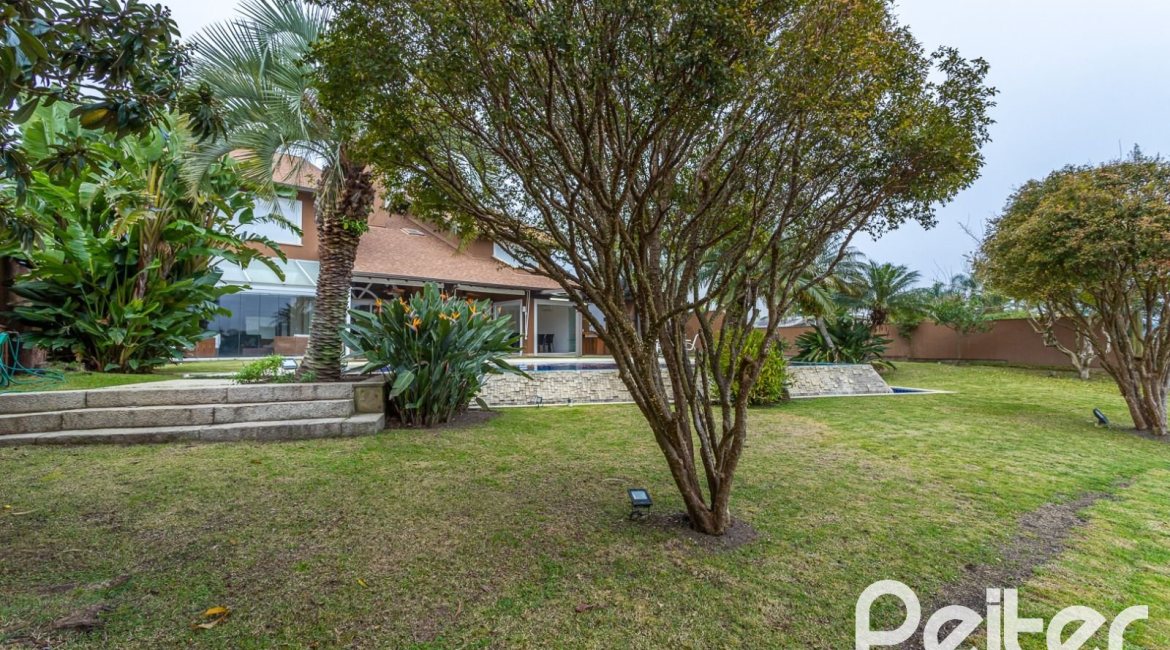 Casa em Condomínio à venda com 615m², 4 dormitórios, 4 suítes, 6 vagas, no bairro Terra Ville em PORTO ALEGRE