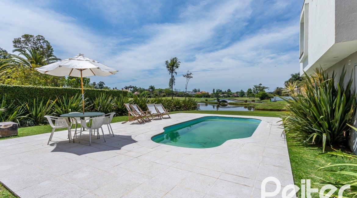 Casa em Condomínio à venda com 418m², 3 dormitórios, 3 suítes, 6 vagas, no bairro Terra Ville em PORTO ALEGRE