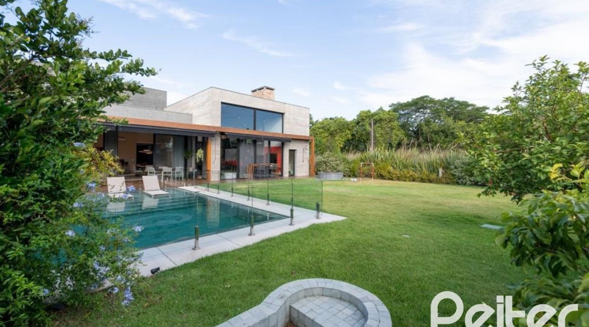 Casa em Condomínio à venda com 550m², 5 dormitórios, 4 suítes, 4 vagas, no bairro Terra Ville em PORTO ALEGRE