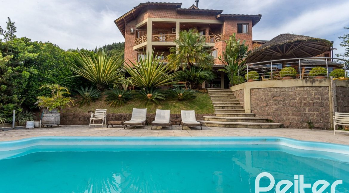Casa em Condomínio à venda com 560m², 5 dormitórios, 2 suítes, 5 vagas, no bairro Campo Novo em Porto Alegre