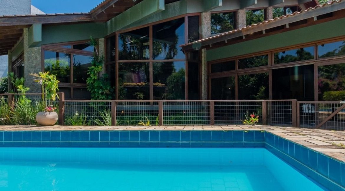 Casa em Condomínio à venda com 600m², 4 dormitórios, 2 suítes, 5 vagas, no bairro Cavalhada em PORTO ALEGRE