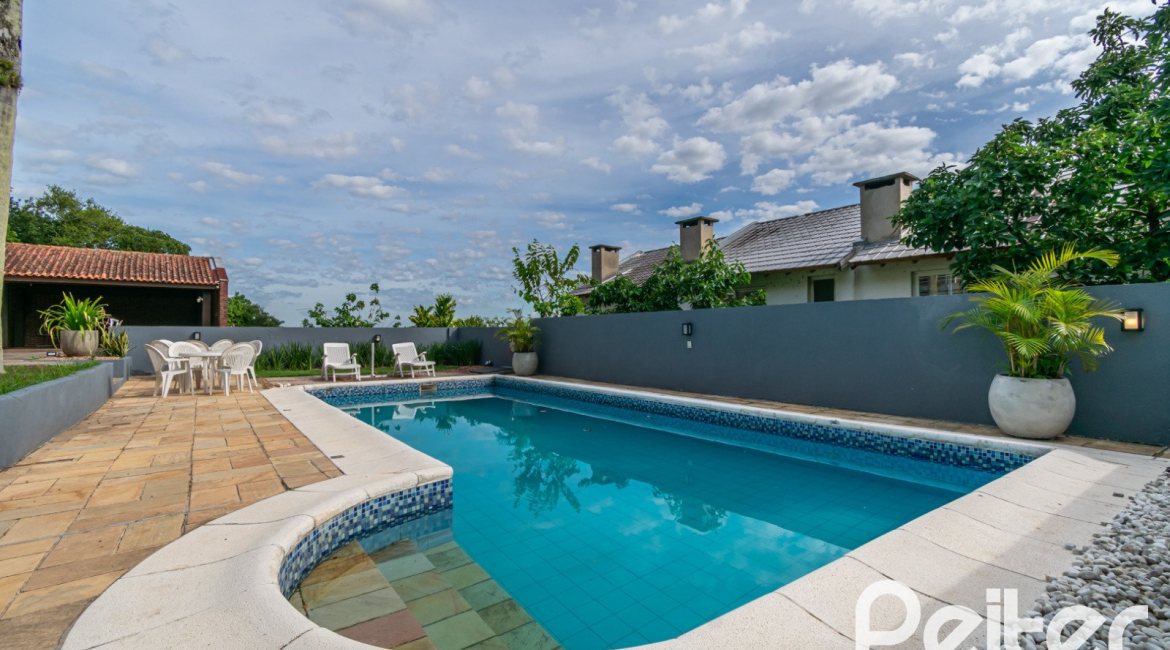 Casa à venda com 312m², 5 dormitórios, 5 suítes, 5 vagas, no bairro Vila Conceição em Porto Alegre