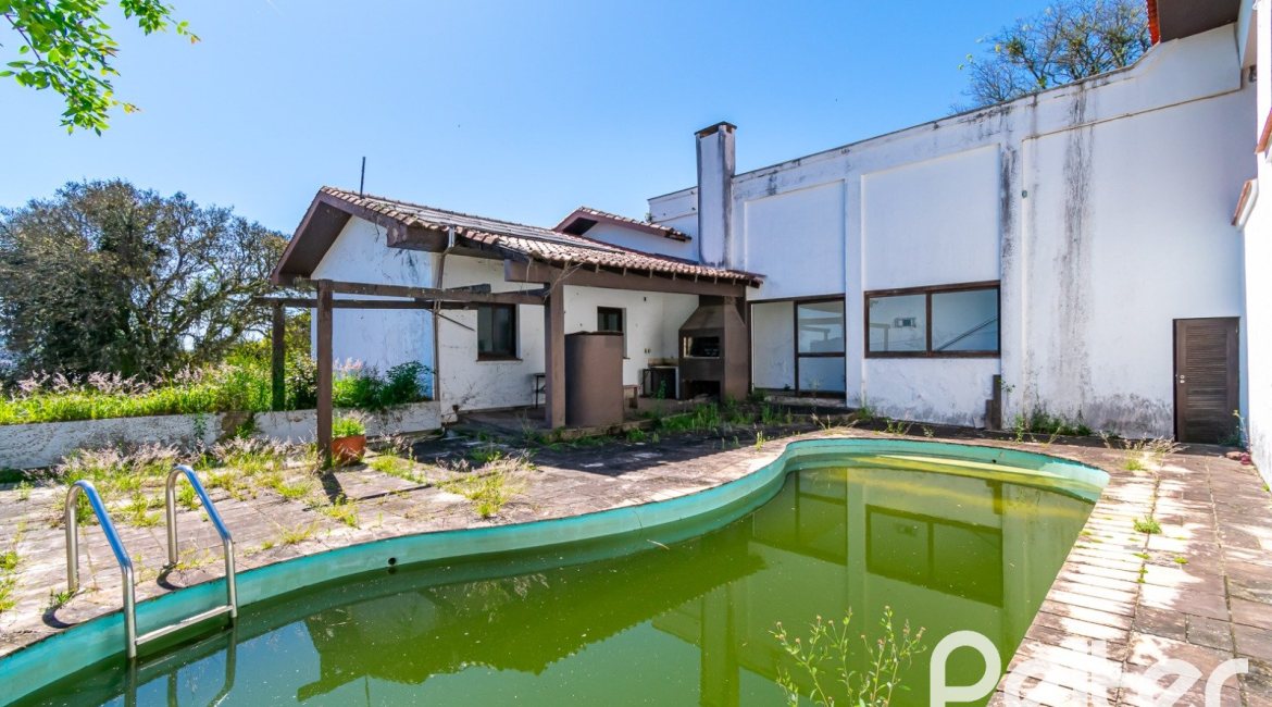 Casa à venda com 528m², 5 dormitórios, 3 suítes, 5 vagas, no bairro Vila Assunção em Porto Alegre