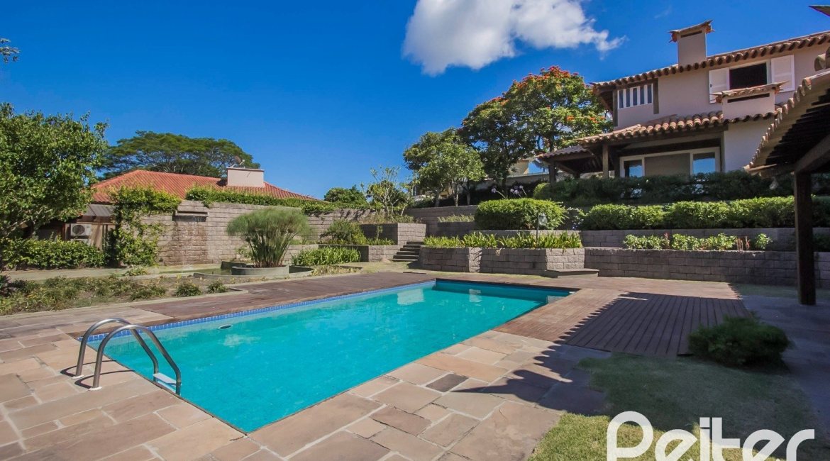 Casa em Condomínio à venda com 830m², 7 dormitórios, 3 suítes, 10 vagas, no bairro Cavalhada em PORTO ALEGRE