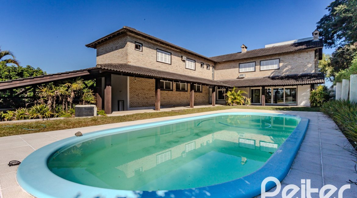 Casa em Condomínio à venda com 545m², 3 dormitórios, 3 suítes, 6 vagas, no bairro Cavalhada em PORTO ALEGRE