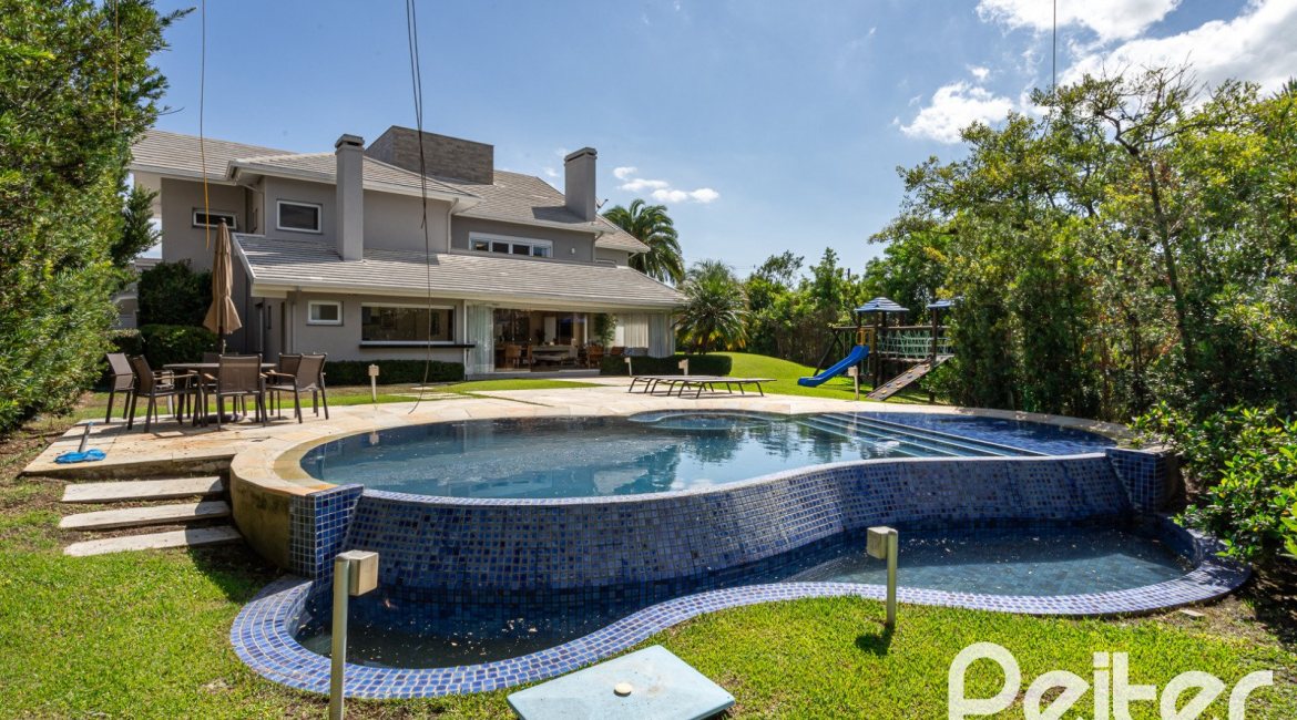 Casa em Condomínio à venda com 587m², 4 dormitórios, 4 suítes, 6 vagas, no bairro Terra Ville em PORTO ALEGRE