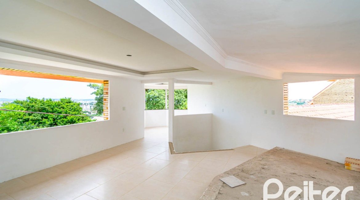 Casa em Condomínio à venda com 390m², 4 dormitórios, 3 suítes, 9 vagas, no bairro Nonoai em Porto Alegre