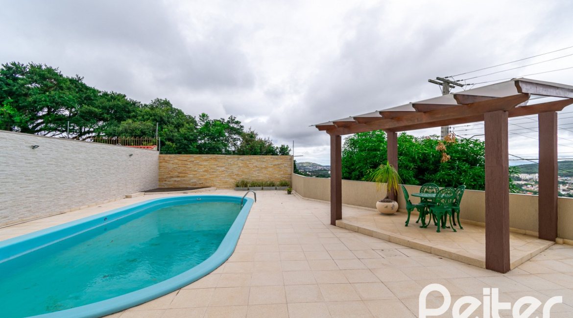 Casa em Condomínio à venda com 477m², 3 dormitórios, 1 suíte, 3 vagas, no bairro Nonoai em Porto Alegre