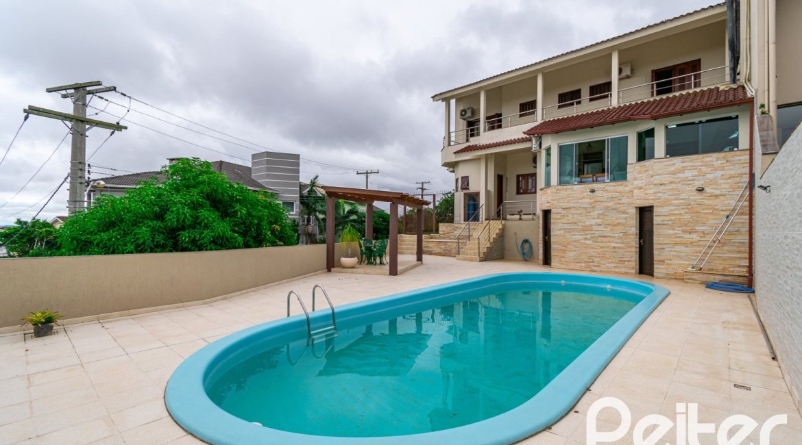 Casa em Condomínio à venda com 477m², 3 dormitórios, 1 suíte, 3 vagas, no bairro Nonoai em Porto Alegre