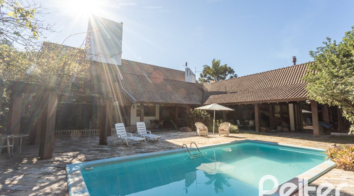 Casa em Condomínio à venda com 701m², 6 dormitórios, 2 suítes, 10 vagas, no bairro Cavalhada em PORTO ALEGRE