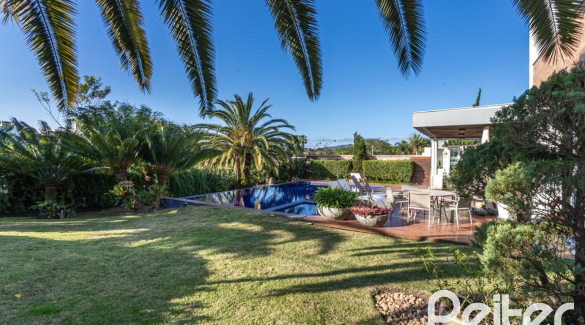 Casa em Condomínio à venda com 510m², 4 dormitórios, 4 suítes, 6 vagas, no bairro Terra Ville em PORTO ALEGRE