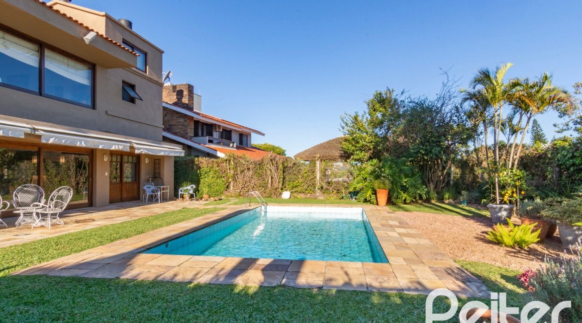Casa em Condomínio à venda com 315m², 3 dormitórios, 3 suítes, 4 vagas, no bairro Cavalhada em PORTO ALEGRE
