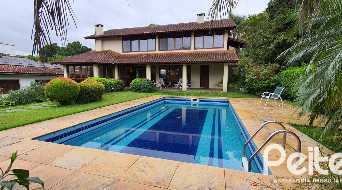 Casa em Condomínio à venda com 299m², 3 dormitórios, 1 suíte, 4 vagas, no bairro Cavalhada em PORTO ALEGRE