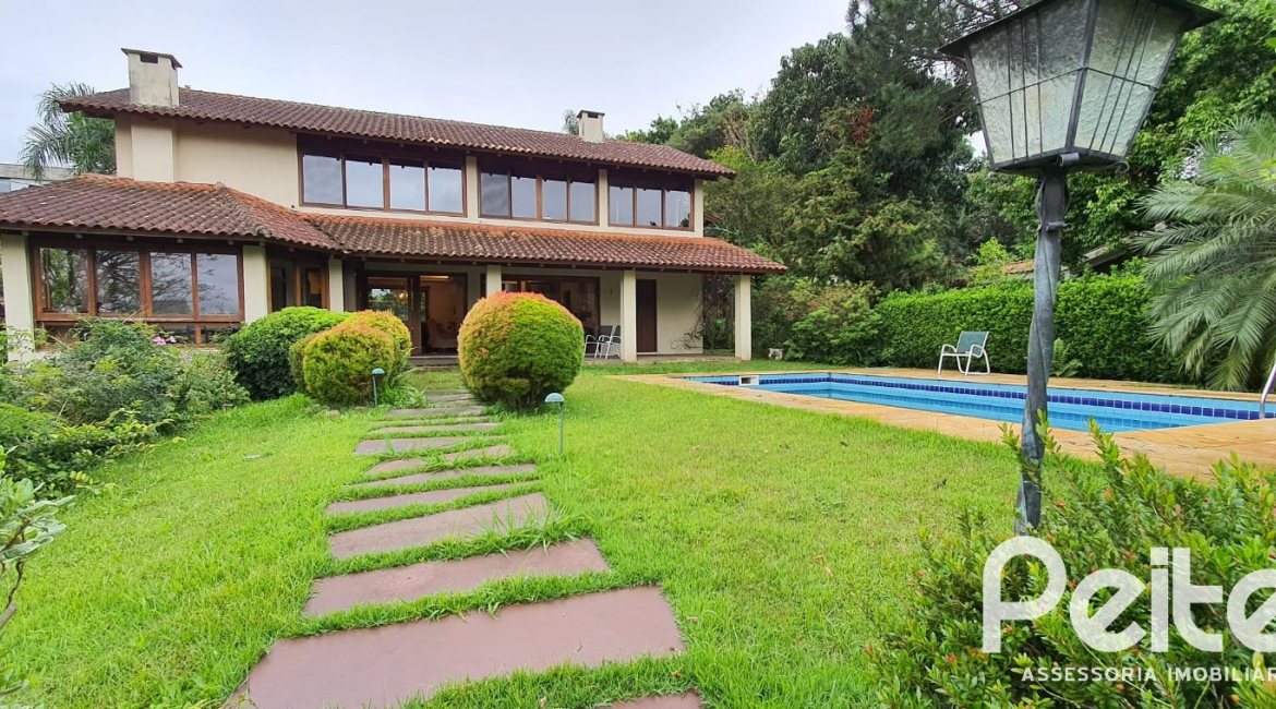 Casa em Condomínio à venda com 299m², 3 dormitórios, 1 suíte, 4 vagas, no bairro Cavalhada em PORTO ALEGRE