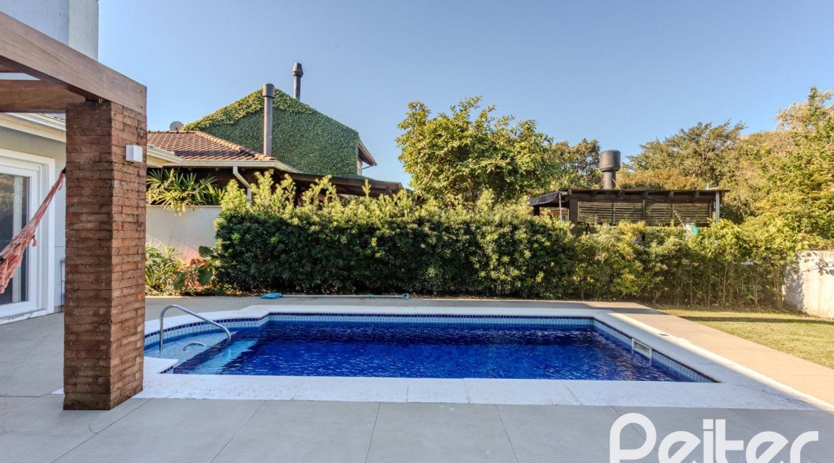 Casa em Condomínio à venda com 216m², 3 dormitórios, 1 suíte, 6 vagas, no bairro Terra Ville em PORTO ALEGRE