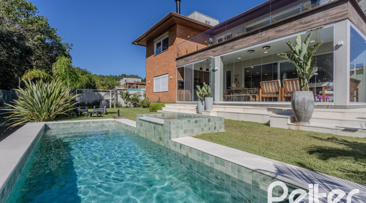 Casa em Condomínio à venda com 340m², 3 dormitórios, 3 suítes, 4 vagas, no bairro Alphaville em PORTO ALEGRE