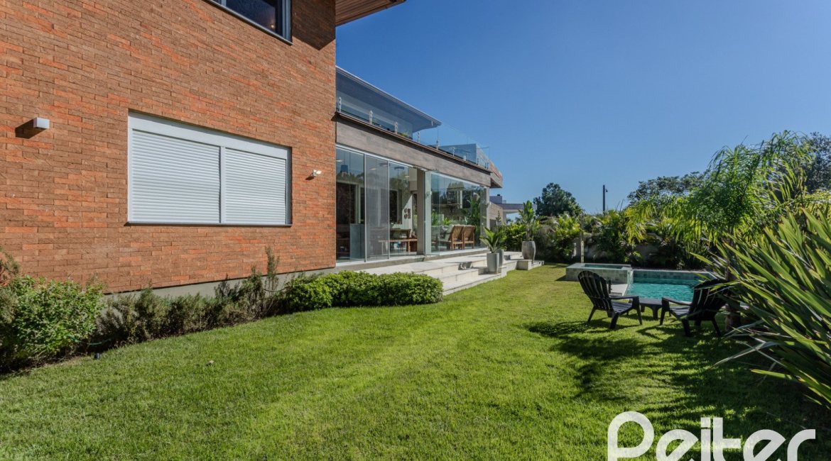 Casa em Condomínio à venda com 340m², 3 dormitórios, 3 suítes, 4 vagas, no bairro Alphaville em PORTO ALEGRE