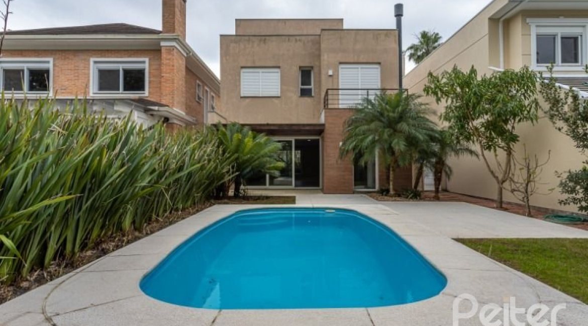 Casa em Condomínio à venda com 243m², 3 dormitórios, 3 suítes, 4 vagas, no bairro Terra Ville em PORTO ALEGRE