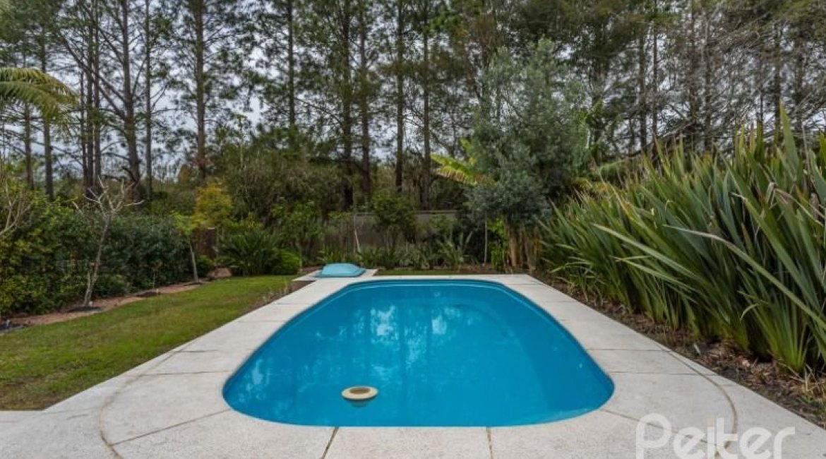 Casa em Condomínio à venda com 243m², 3 dormitórios, 3 suítes, 4 vagas, no bairro Terra Ville em PORTO ALEGRE