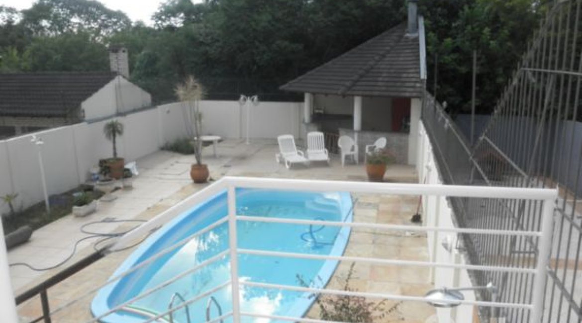 Casa à venda com 445m², 4 dormitórios, 2 suítes, 2 vagas, no bairro Ipanema em Porto Alegre