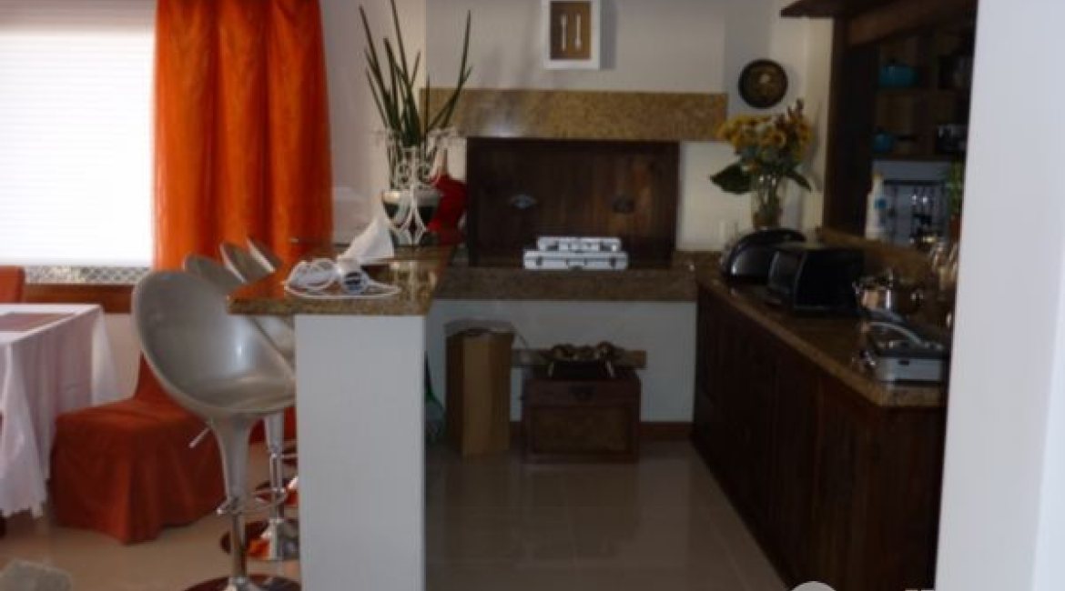 Casa em Condomínio à venda com 500m², 4 dormitórios, 4 suítes, 3 vagas, no bairro Vila Assunção em Porto Alegre