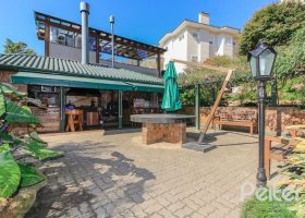 Casa em Condomínio à venda com 609m², 6 dormitórios, 2 suítes, 3 vagas, no bairro Cavalhada em PORTO ALEGRE