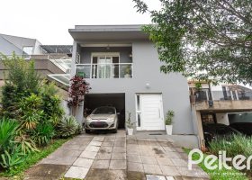 Casa em Condomínio à venda com 132m², 3 dormitórios, 1 suíte, 2 vagas, no bairro Vila Nova em PORTO ALEGRE