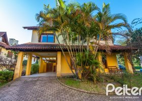 Casa em Condomínio à venda com 174m², 3 dormitórios, 1 suíte, 2 vagas, no bairro Guarujá em Porto Alegre