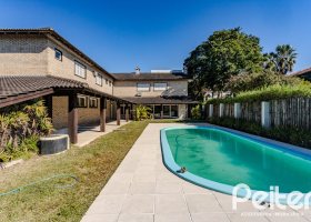Casa em Condomínio à venda com 545m², 3 dormitórios, 3 suítes, 6 vagas, no bairro Cavalhada em PORTO ALEGRE