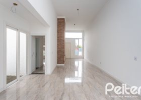 Casa em Condomínio à venda com 90m², 3 dormitórios, 1 suíte, 2 vagas, no bairro Aberta dos Morros em Porto Alegre
