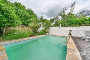 Casa em Condomínio à venda com 389m², 4 dormitórios, 3 suítes, 4 vagas, no bairro Vila Nova em Porto Alegre