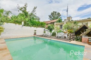 Casa em Condomínio à venda com 389m², 4 dormitórios, 3 suítes, 4 vagas, no bairro Vila Nova em Porto Alegre