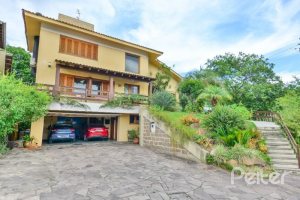 Casa em Condomínio à venda com 389m², 4 dormitórios, 3 suítes, 4 vagas, no bairro Vila Nova em Porto Alegre