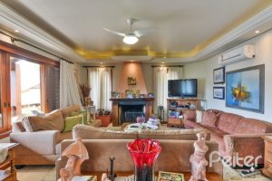 Casa em Condomínio à venda com 389m², 4 dormitórios, 3 suítes, 4 vagas, no bairro Vila Nova em Porto Alegre