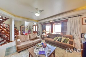 Casa em Condomínio à venda com 389m², 4 dormitórios, 3 suítes, 4 vagas, no bairro Vila Nova em Porto Alegre