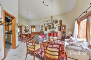 Casa em Condomínio à venda com 389m², 4 dormitórios, 3 suítes, 4 vagas, no bairro Vila Nova em Porto Alegre