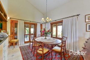 Casa em Condomínio à venda com 389m², 4 dormitórios, 3 suítes, 4 vagas, no bairro Vila Nova em Porto Alegre