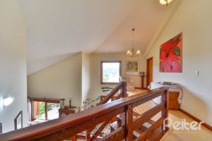 Casa em Condomínio à venda com 389m², 4 dormitórios, 3 suítes, 4 vagas, no bairro Vila Nova em Porto Alegre