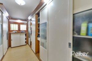 Casa em Condomínio à venda com 389m², 4 dormitórios, 3 suítes, 4 vagas, no bairro Vila Nova em Porto Alegre