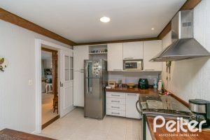 Casa em Condomínio à venda com 321m², 4 dormitórios, 2 suítes, 4 vagas, no bairro Terra Ville em PORTO ALEGRE