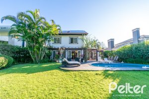 Casa em Condomínio à venda com 321m², 4 dormitórios, 2 suítes, 4 vagas, no bairro Terra Ville em PORTO ALEGRE