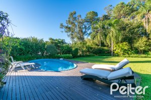 Casa em Condomínio à venda com 321m², 4 dormitórios, 2 suítes, 4 vagas, no bairro Terra Ville em PORTO ALEGRE