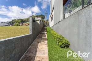 Casa em Condomínio à venda com 303m², 3 dormitórios, 3 suítes, 4 vagas, no bairro Alphaville em PORTO ALEGRE