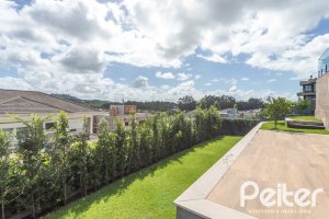 Casa em Condomínio à venda com 303m², 3 dormitórios, 3 suítes, 4 vagas, no bairro Alphaville em PORTO ALEGRE